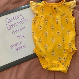 6 month onesie, never worn